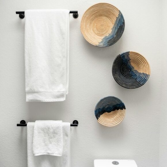 Small Bathroom Organization Ideas That Save Space (and Look Good) Small bathroom with organized shelves, towels and toiletries
