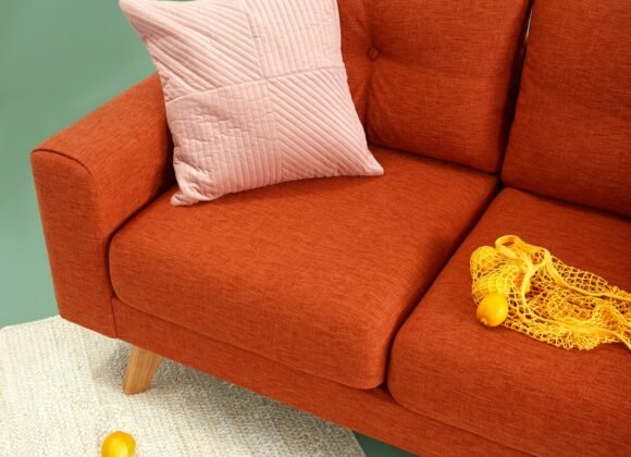 Cozy living room with warm lamp lighting and layered textures creating an inviting atmosphere