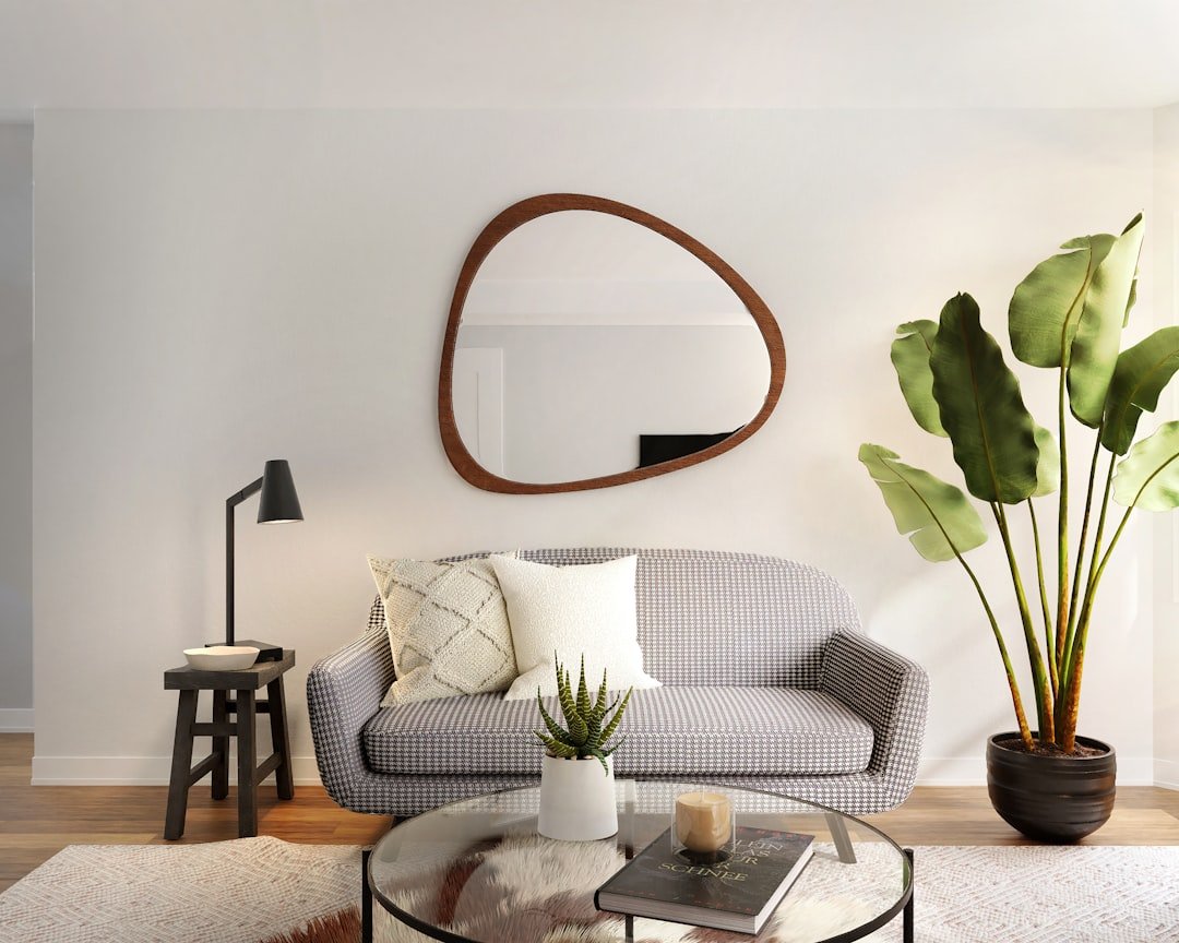 Small living room decorated with plants and a large mirror