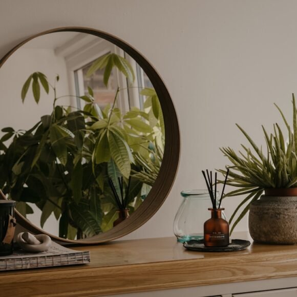 Boho bedroom decor with rattan furniture, terracotta pots and trailing plants