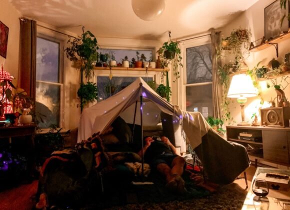 A cozy small apartment decorated for Christmas with festive renter-friendly decorations
