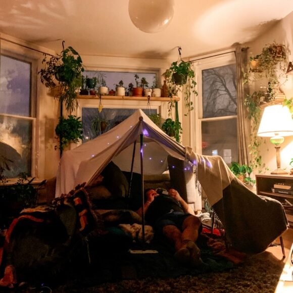 A cozy small apartment decorated for Christmas with festive renter-friendly decorations