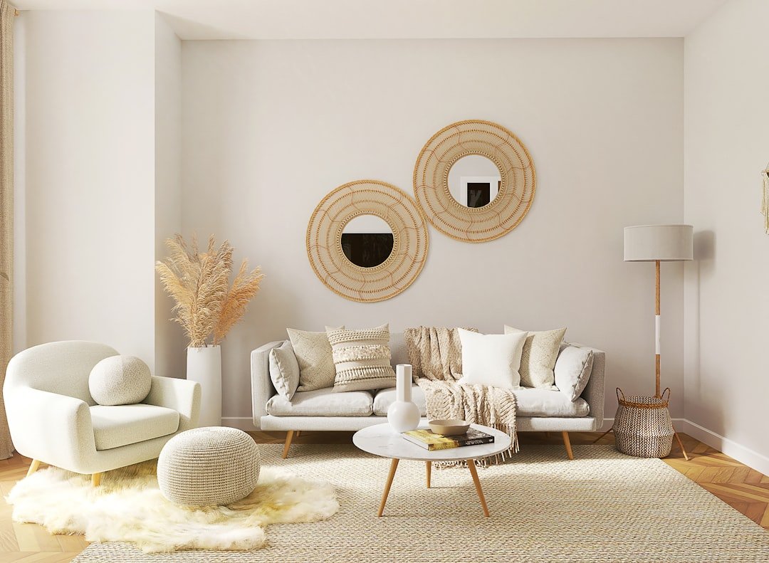 A cozy small apartment living room decorated with furniture, soft textiles, and a mirror to create a welcoming space