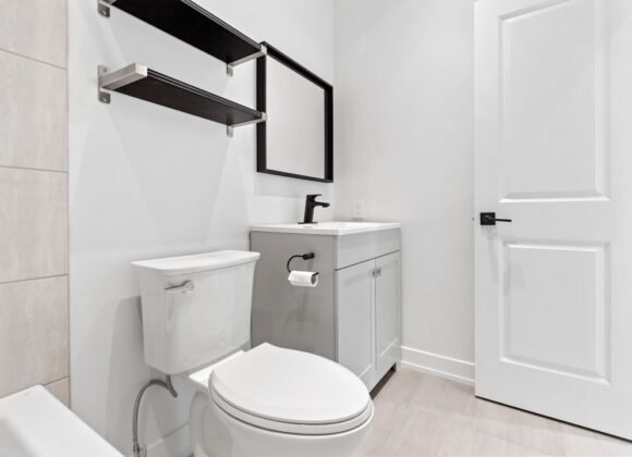 Apartment Bathroom Storage Ideas for Small Bathrooms A small apartment bathroom with smart storage solutions including shelving above the toilet