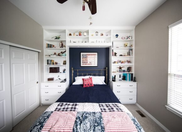 Small Bedroom Storage Ideas for Tiny Apartments A small bedroom with smart storage organization solutions including shelving and under-bed storage
