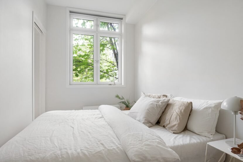 Small Bedroom Decor Ideas That Make the Room Look Bigger Small bright bedroom with white decor and natural light