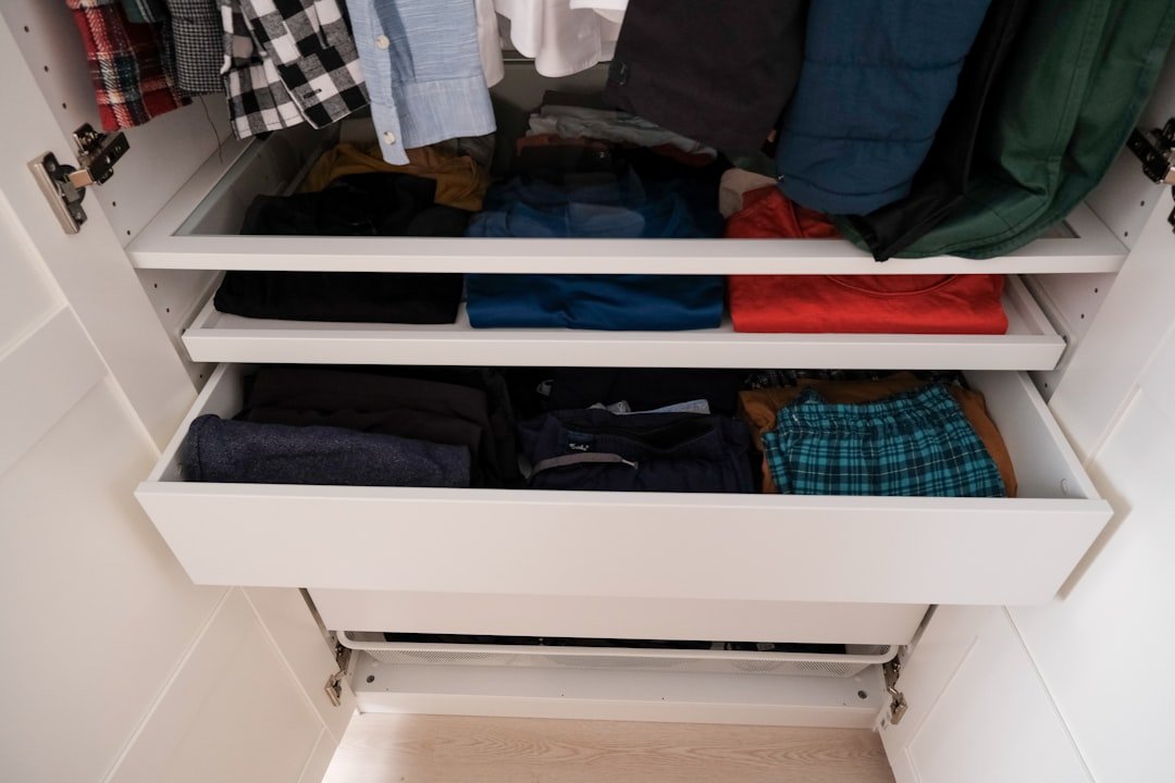 Open wardrobe storage solution in a small bedroom without a closet