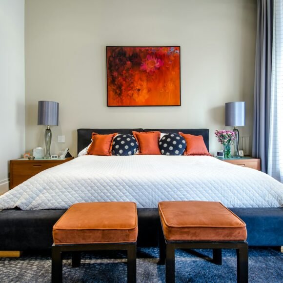 Cozy rental bedroom with neutral decor and warm lighting