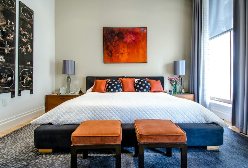 Cozy rental bedroom with neutral decor and warm lighting