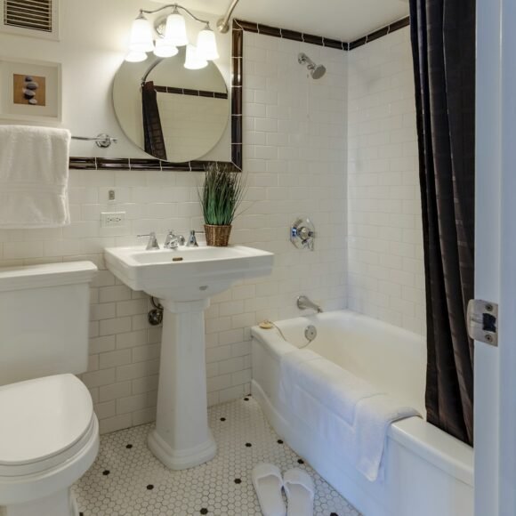 Apartment Bathroom Ideas and Storage That Need Zero Renovation Small rental bathroom with a pedestal sink and no counter storage