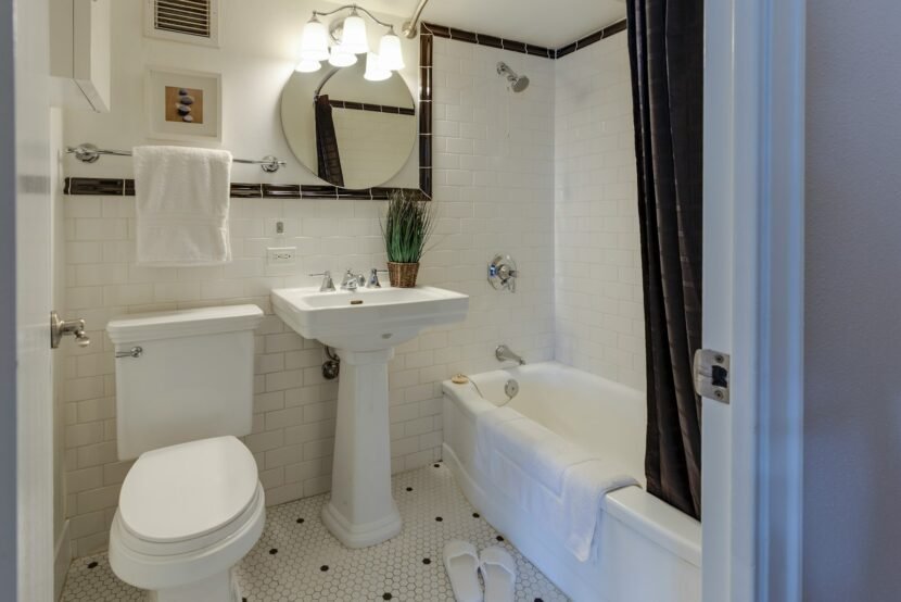 Apartment Bathroom Ideas and Storage That Need Zero Renovation Small rental bathroom with a pedestal sink and no counter storage