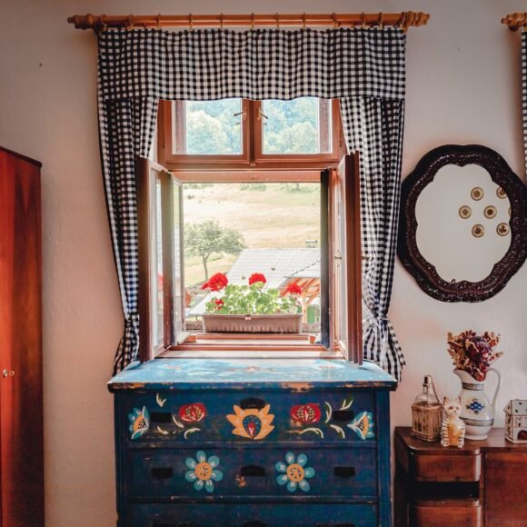 English Cottage Bedroom Ideas for a Modern Home Blue painted wooden dresser with a mirror in a cottage bedroom