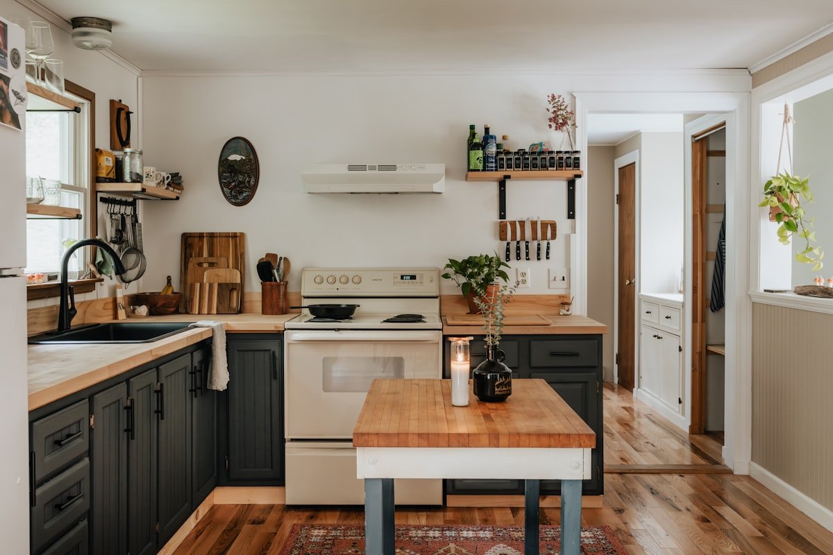 Cottage interior mixing painted and bare wood furniture