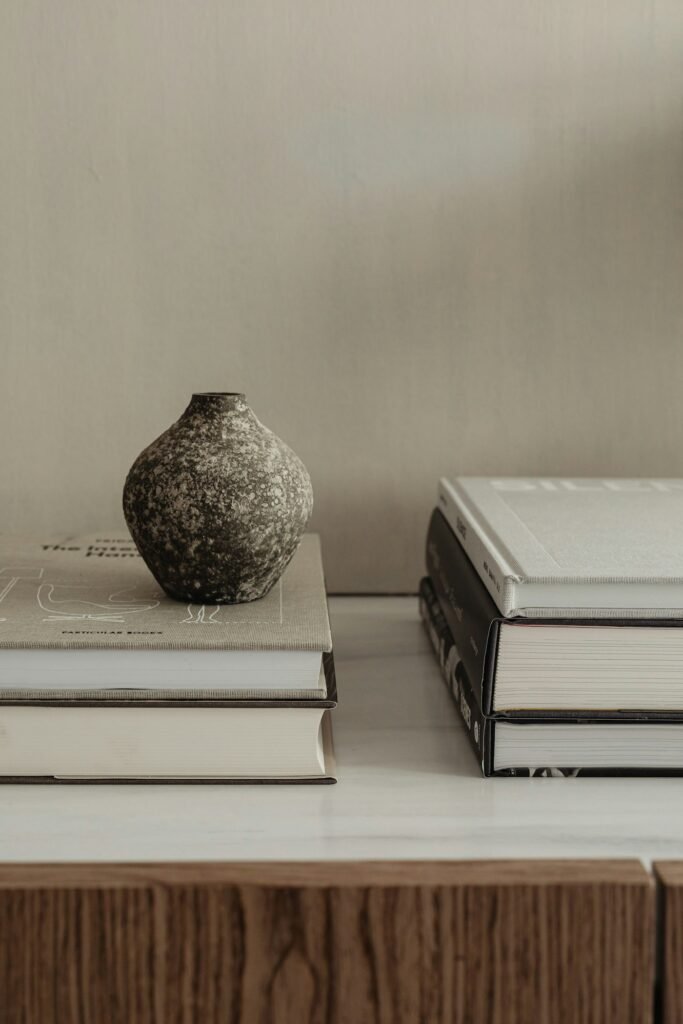 Cozy styled neutral home interior with plants and books