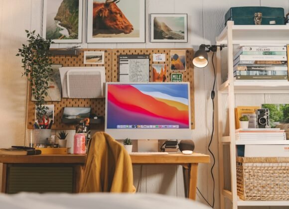 A tidy, compact home office workstation with a laptop, desk accessories, and natural light for a focused work-from-home setup