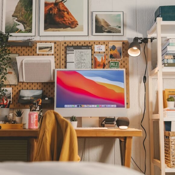 A tidy, compact home office workstation with a laptop, desk accessories, and natural light for a focused work-from-home setup