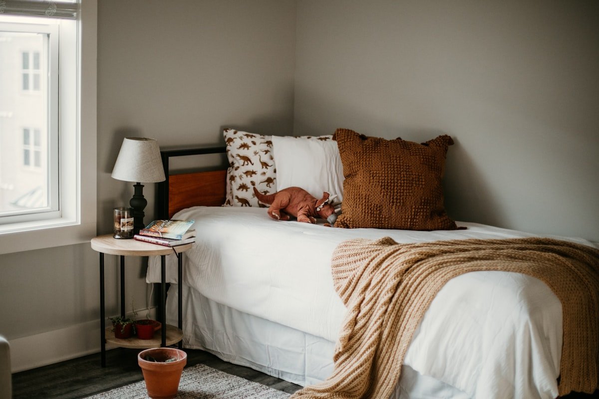 Bedroom lit by low warm lamps rather than an overhead light