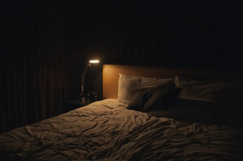 Dark Small Bedroom Ideas: How to Decorate a Room With No Natural Light Cozy small bedroom with no natural light lit by a warm bedside lamp