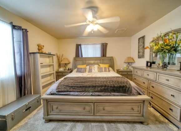 Calm bedroom with dresser storage and mirror keeping surfaces clear of clutter