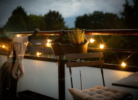 Cozy Fall Balcony Ideas to Enjoy Autumn Outside Small balcony with a chair and potted plant