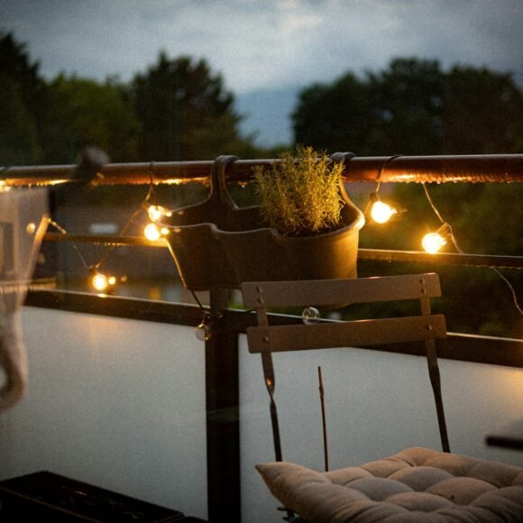 Small balcony with a chair and potted plant