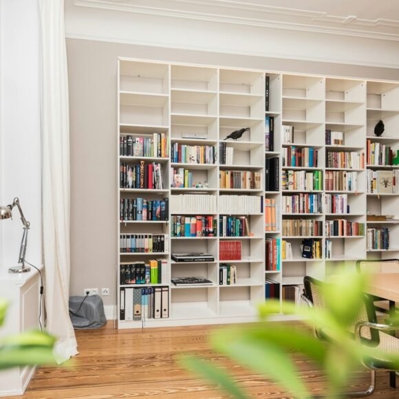White cube shelving unit used as room storage