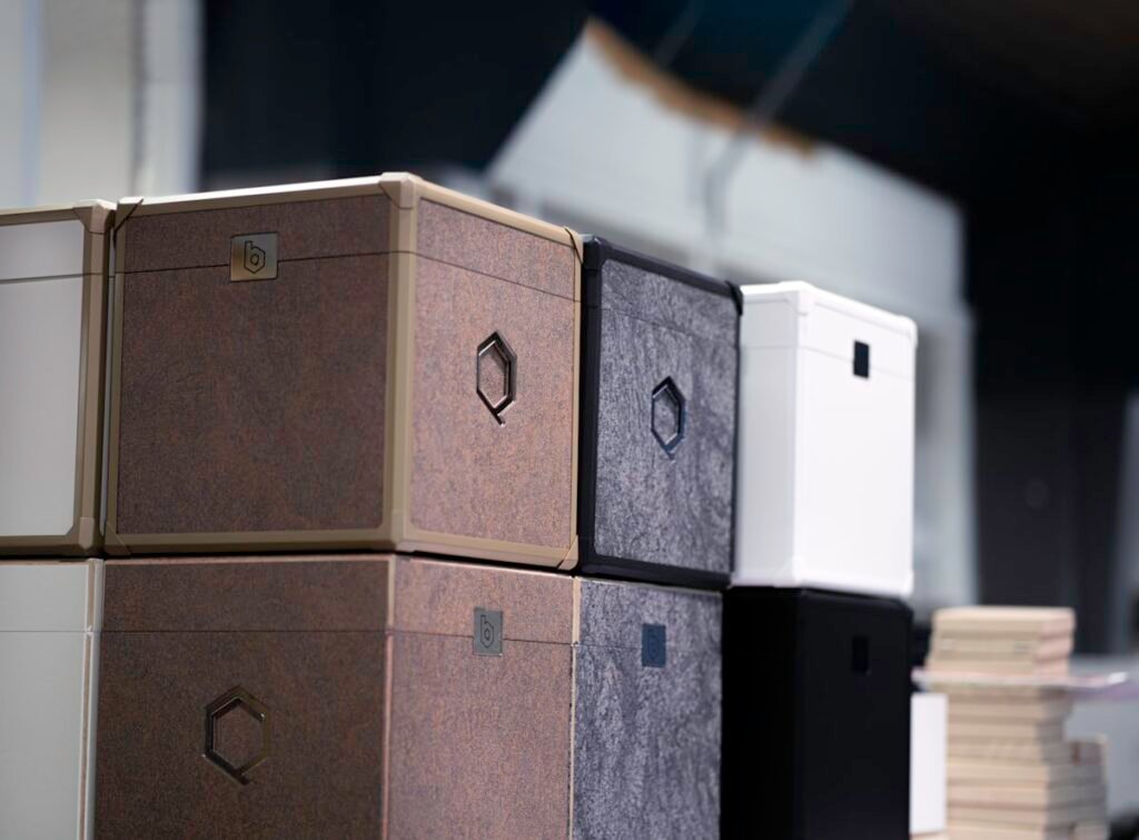 Grey fabric storage boxes filling cube shelf openings