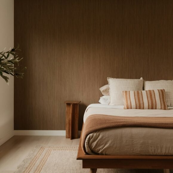 Minimalist Bedroom Ideas That Feel Warm and Restful Warm minimalist bedroom with layered linen bedding and soft natural light