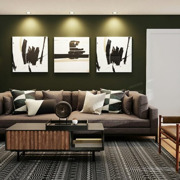 Living room with a brown sofa and patterned pillows in front of a dark green painted wall